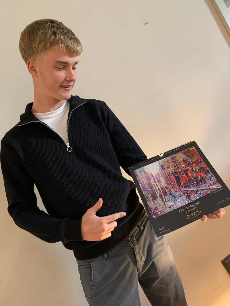 Young man holding calendar 